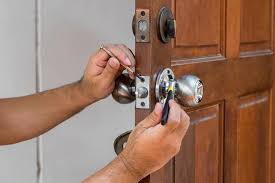Technician rekeying a residential door lock